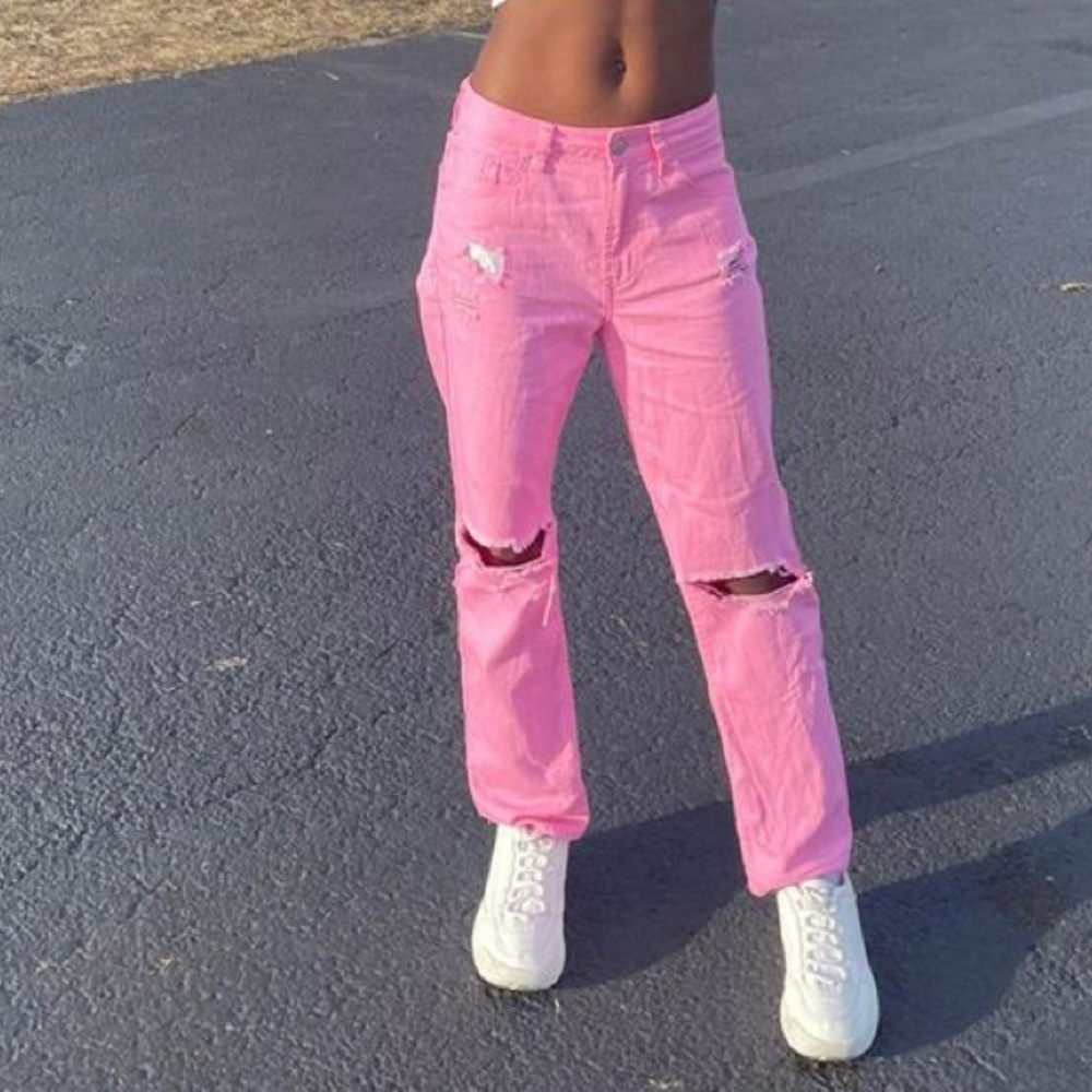 Pink distressed denim jeans